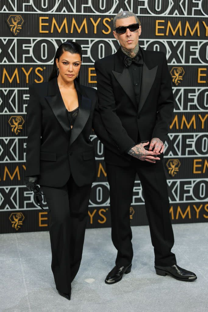 kourtney kardashian and travis barker at 75th primetime emmy awards arrivals