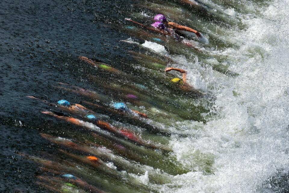 Athletes compete in the swimming stage of the Women's Elite Triathlon competition at the European Championships Munich 2022 in Munich, Germany.