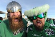 Saskatchewan Roughriders fansBen Bandenberg, left, and Dave Friesen ham it up outside Mosaic Stadium before the Grey Cup game, Sunday, November 24, 2012 in Regina. THE CANADIAN PRESS/Liam Richards