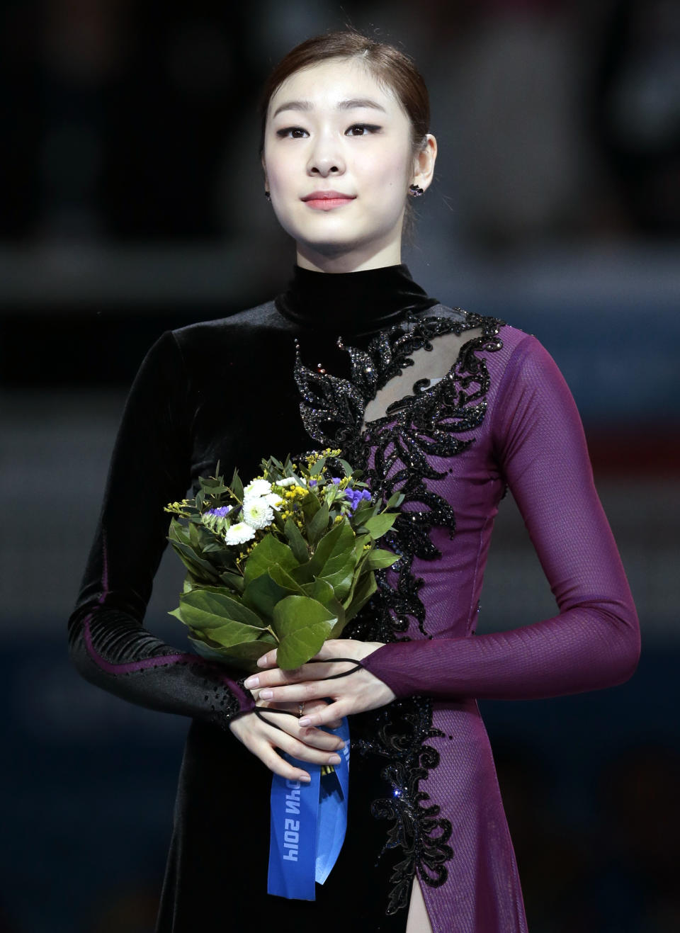 Yuna Kim of South Korea poses on the podium after placing second in the women's free skate figure skating finals at the Iceberg Skating Palace during the 2014 Winter Olympics, Thursday, Feb. 20, 2014, in Sochi, Russia. (AP Photo/Ivan Sekretarev)