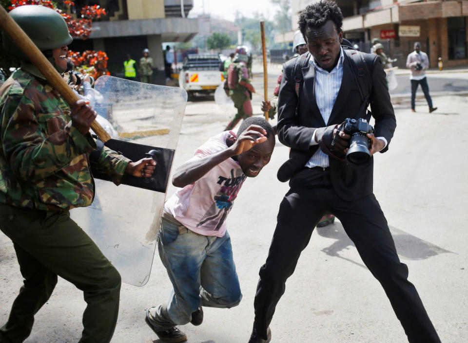 A Kenyan policeman beats a protester during clashes in Nairobi, Kenya, May 16, 2016. (Reuters/Goran Tomasevic)