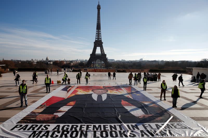 FILE PHOTO: Climate activists mark the fifth anniversary of the Paris Agreement on climate change, in Paris