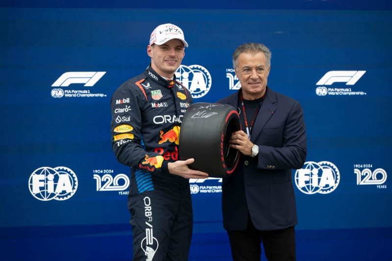 RedBull's Max Verstappen (L) accepts his pole reward in Parc Femme after he qualified on pole on Qualifying day of the 2024 Formula 1 Japanese Grand Prix from former F1 driver Jean Robert Alesi. Taidgh Barron/ZUMA Press Wire/dpa