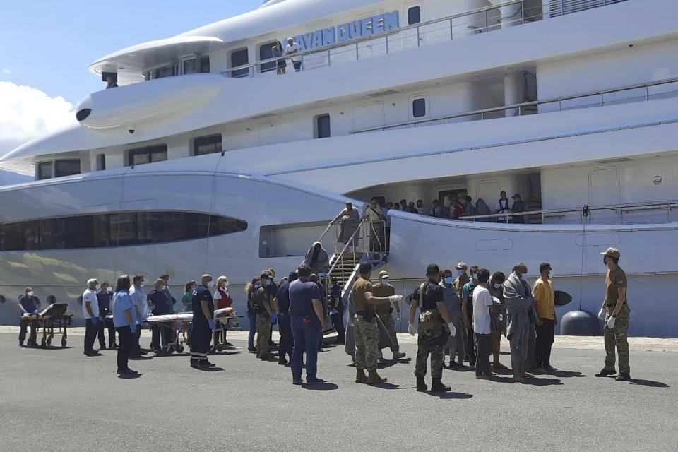 Survivors arrive by yacht after a rescue operation at the port in Kalamata town, about 240 kilometers (150miles) southwest of Athens on Wednesday, June 14, 2023. Authorities say at least 32 people have died after a fishing boat carrying dozens of migrants capsized and sank off the southern coast of Greece. A large search and rescue operation is underway. Authorities said 104 people have been rescued so far following the incident early Wednesday some 75 kilometers (46 miles) southwest of Greece’s southern Peloponnese region.(www.argolikeseidhseis.gr via AP)