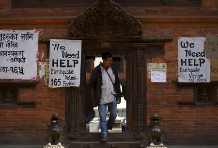 Earthquake victims put up a notice for help on the walls of a temple after last week's earthquake in Bhaktapur, Nepal May 2, 2015. REUTERS/Navesh Chitrakar