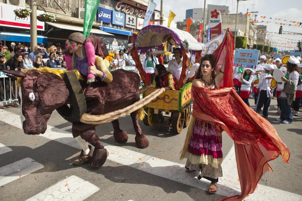 Israelis parade with a float to celebrate the Jewish holiday of Purim on February 24, 2013 in the central Israeli city of Netanya. (Jack Guez/AFP/Getty Images)