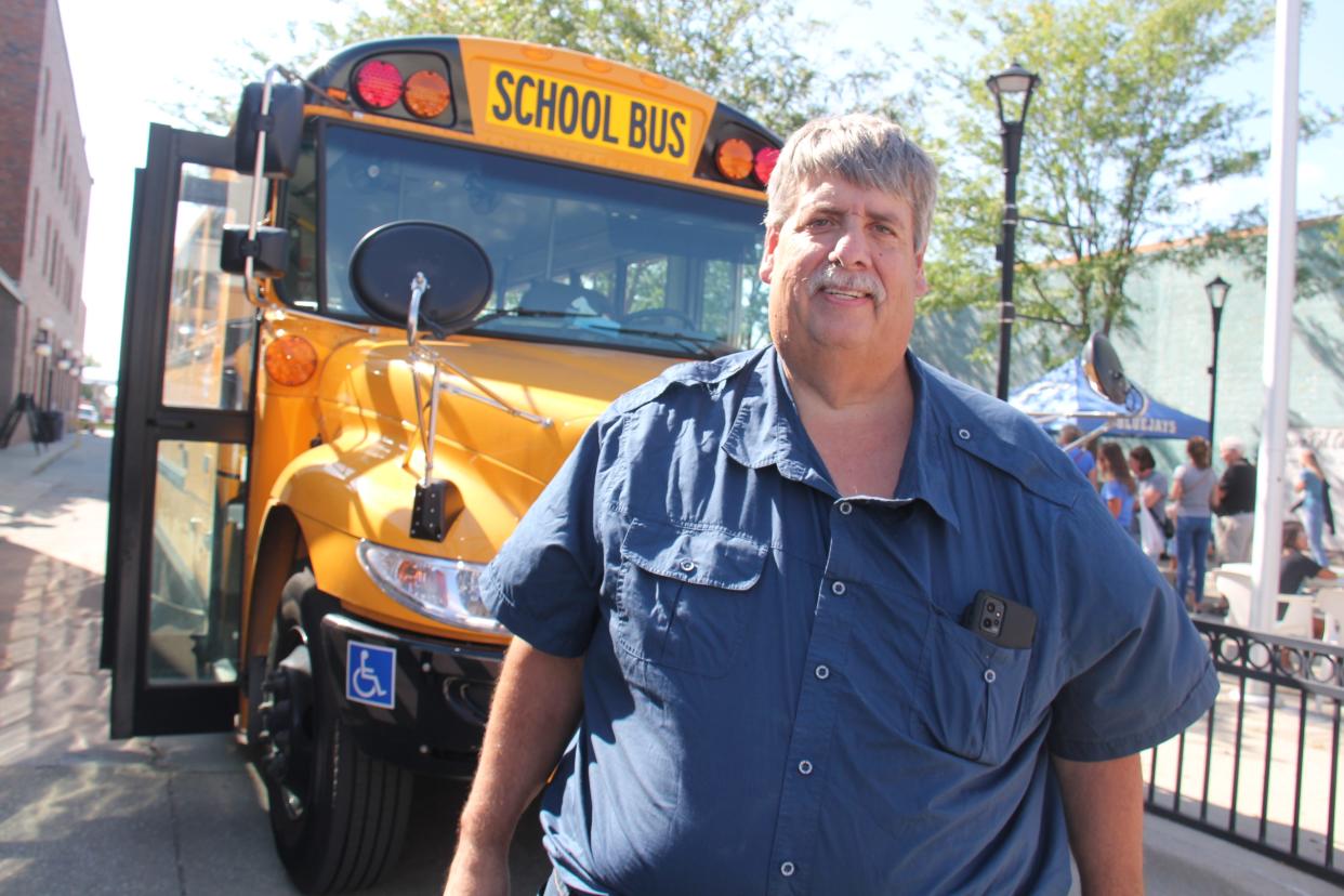 Troy Griffith, who recently received the 2023 Tom Horn Memorial Award from the Iowa Pupil Transportation Association, poses for a photo during Back to School Night at the Perry Farmers Market on Thursday, Aug. 17, 2023.