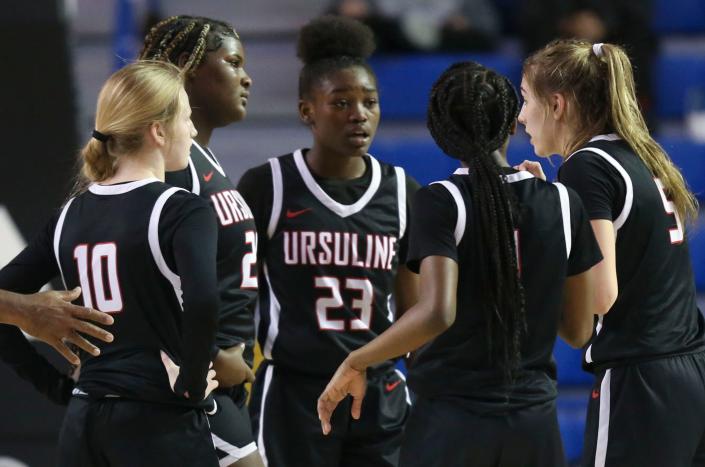 Ursuline's (from left) Emma Anthony, Skylar Bolden, Jezelle Banks, Taylor Brown and Hannah Kelley get together in a timeout late in the second half of the Warriors' 58-46 win in the DIAA state tournament championship game at the Bob Carpenter Center, Friday, March 10, 2023.