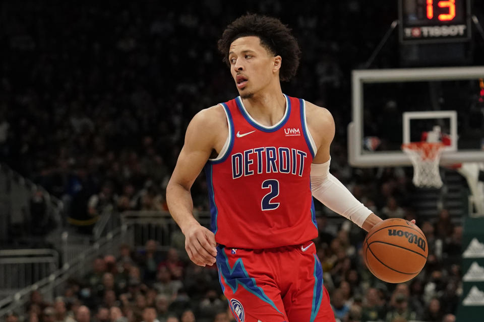 Cade Cunningham of the Detroit Pistons dribbles the ball during a game.