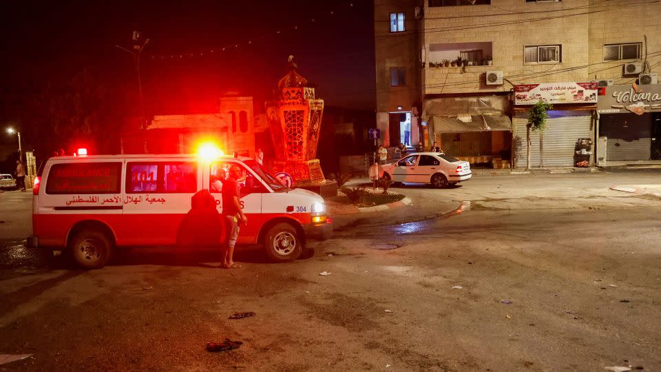 An ambulance is seen at the site of Israeli strikes where Palestinians were killed, in Tubas in the occupied West Bank, on September 11, 2024. - Raneen Sawafta/Reuters