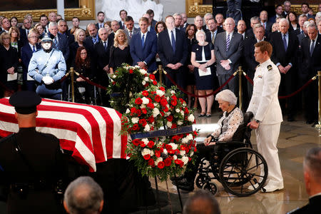 Roberta McCain, mother of late U.S. Senator John McCain, sits at the foot of her son's casket during ceremonies honoring Senator McCain inside the U.S. Capitol Rotunda in Washington, U.S., August 31, 2018. REUTERS/Kevin Lamarque