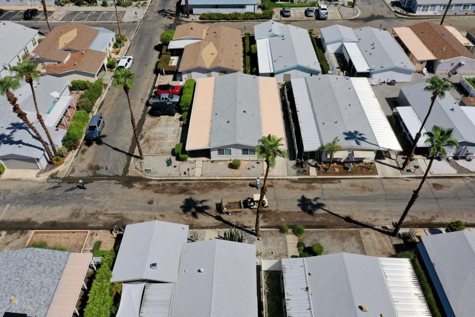 Once-flooded roads inside the Canyon Mobile Home Community in Cathedral City dry up Monday in the aftermath of Tropical Storm Hilary.