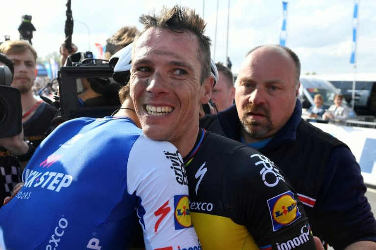 Belgian cyclist Philippe Gilbert (centre) is congratulated by Dutch rival Niki Terpstra after the Tour of Flanders, a 260km from Antwerp to Oudenaarde, on April 2, 2017