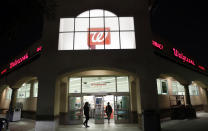 FILE - In this June 24, 2019 file photo, shoppers enter a Walgreens store in Los Angeles. Lawsuits filed by two Ohio counties against retail pharmacy chains CVS, Walgreens, Rite Aid, Walmart and Giant Eagle claiming their opioid dispensing practices flooded communities with pain pills and were a a public nuisance can continue after U.S. District Judge Dan Polster, a federal judge in Cleveland, denied the chains' motion to dismiss the complaints in a ruling Thursday, Aug. 6, 2020. (AP Photo/Marcio Jose Sanchez, File)