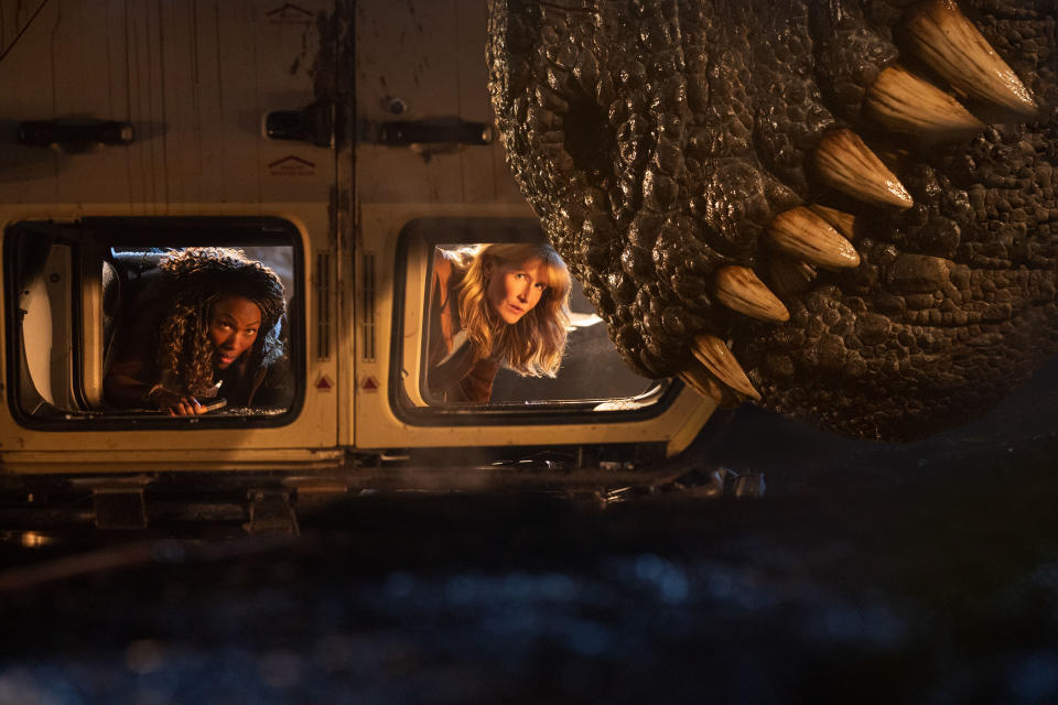 Kayla Watts (DeWanda Wise), Dr. Ellie Sattler (Laura Dern) and a Giganotosaurus - Credit: John Wilson/Universal Pictures a