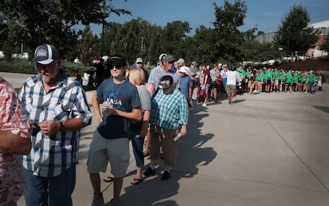 People wait for the gates to open at Saluki Stadium on the campus of Southern Illinois University to watch the solar eclipse - Credit: Getty 