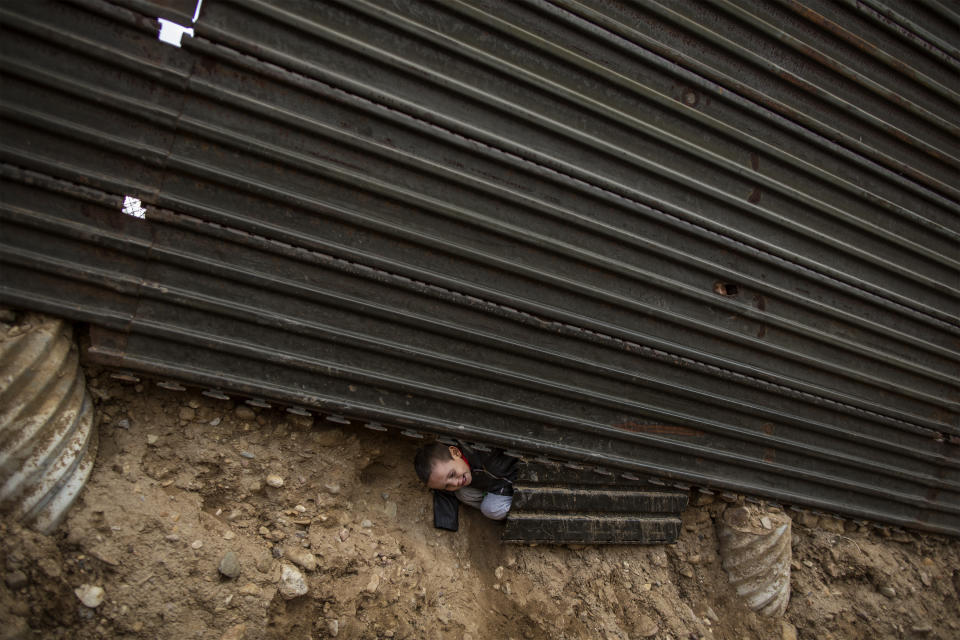 Schneider crosses under the wall between Mexico and US, December 1, 2018. (Photo: Fabio Bucciarelli for Yahoo News)