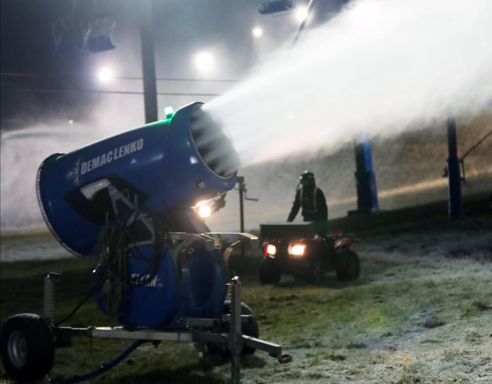 A member of the late night snow making crew at Thunder Ridge Ski Area checks on one of the snow guns on the mountain in Patterson Nov. 28, 2023.