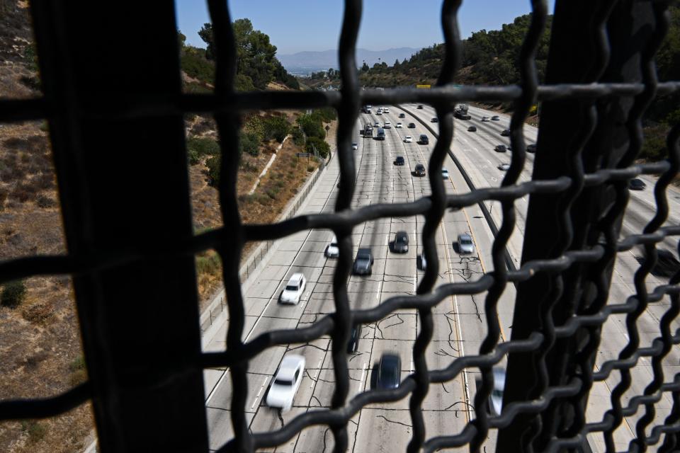 Cars, trucks, SUVs and other vehicles drive in traffic on the 405 freeway through the Sepulveda Pass in Los Angeles, California, on August 25, 2022.