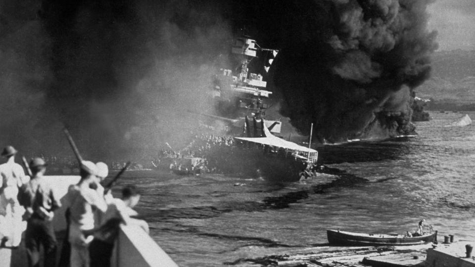  The USS California is seen on fire at Pearl Harbor after the Japanese attack. (Photo by Fox Photos/Getty Images) - Fox Photos/Hulton Archive/Getty Images
