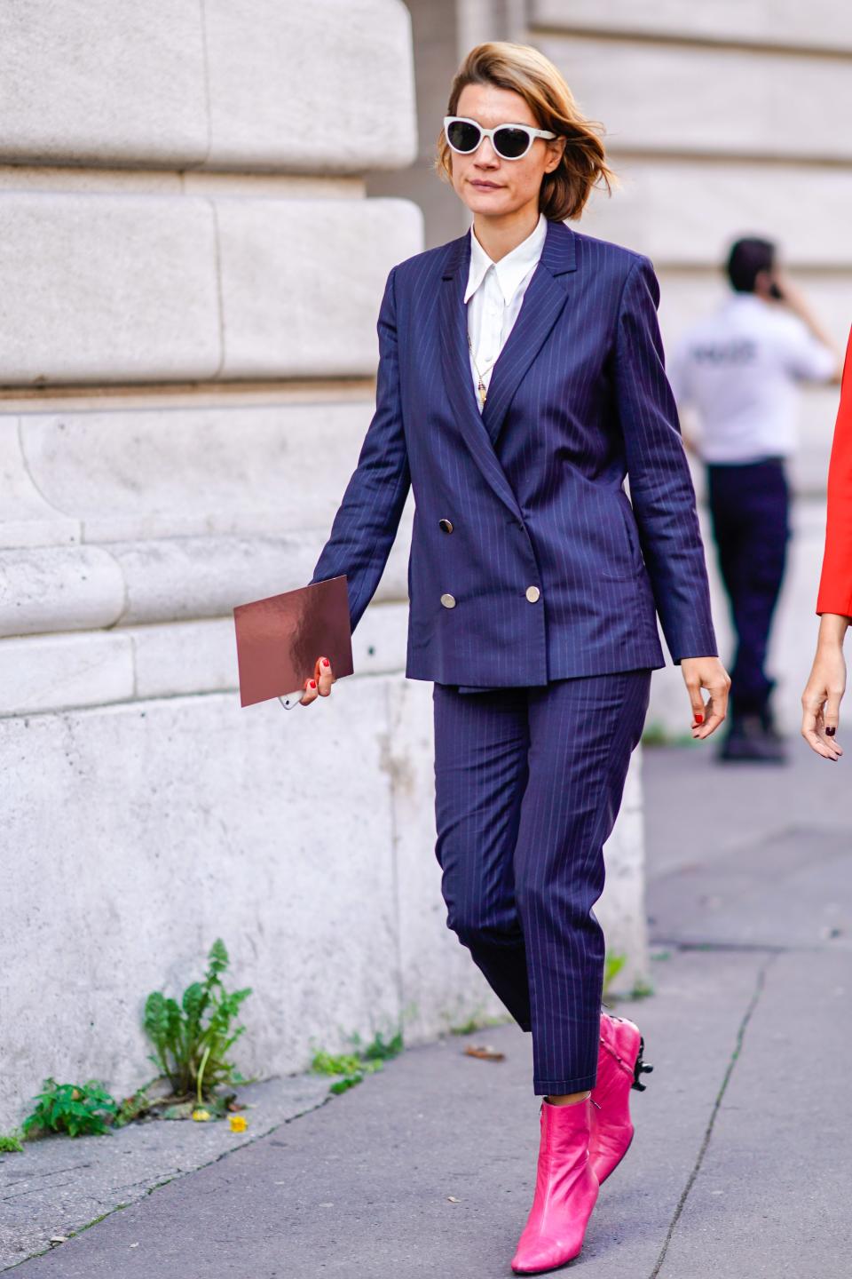 All hail the double-breasted cropped suit. Give it a feminine spin with hot-pink boots.