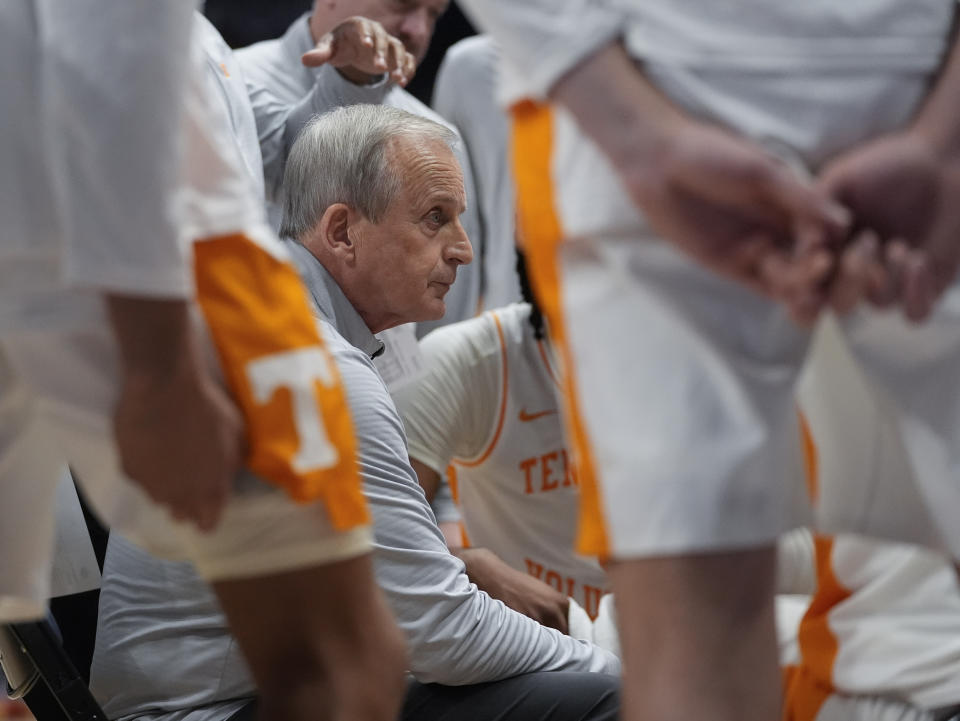 Tennessee head coach Rick Barnes huddles his players during a timeout in the first half of an NCAA college basketball game against Mississippi State at the Southeastern Conference tournament Friday, March 15, 2024, in Nashville, Tenn. (AP Photo/John Bazemore)