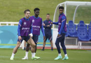 England's Jack Grealish, Bukayo Saka and Marcus Rashford, from left, during a training session at St George's Park, Burton upon Trent, England, Saturday July 10, 2021, ahead of their Euro 2020 soccer championship final match against Italy at Wembley Stadium on Sunday. (AP Photo/Dave Thompson)