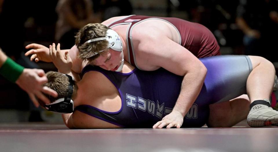 State College’s Nick Pavlechko gets three points in the 285 lb bout against Mifflin County’s Dekker Pietzsch during the match on Thursday, Jan. 25, 2024.