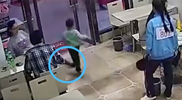 A pregnant woman has been caught on camera tripping a child in a Chinese restaurant. Source: South China Morning Post
