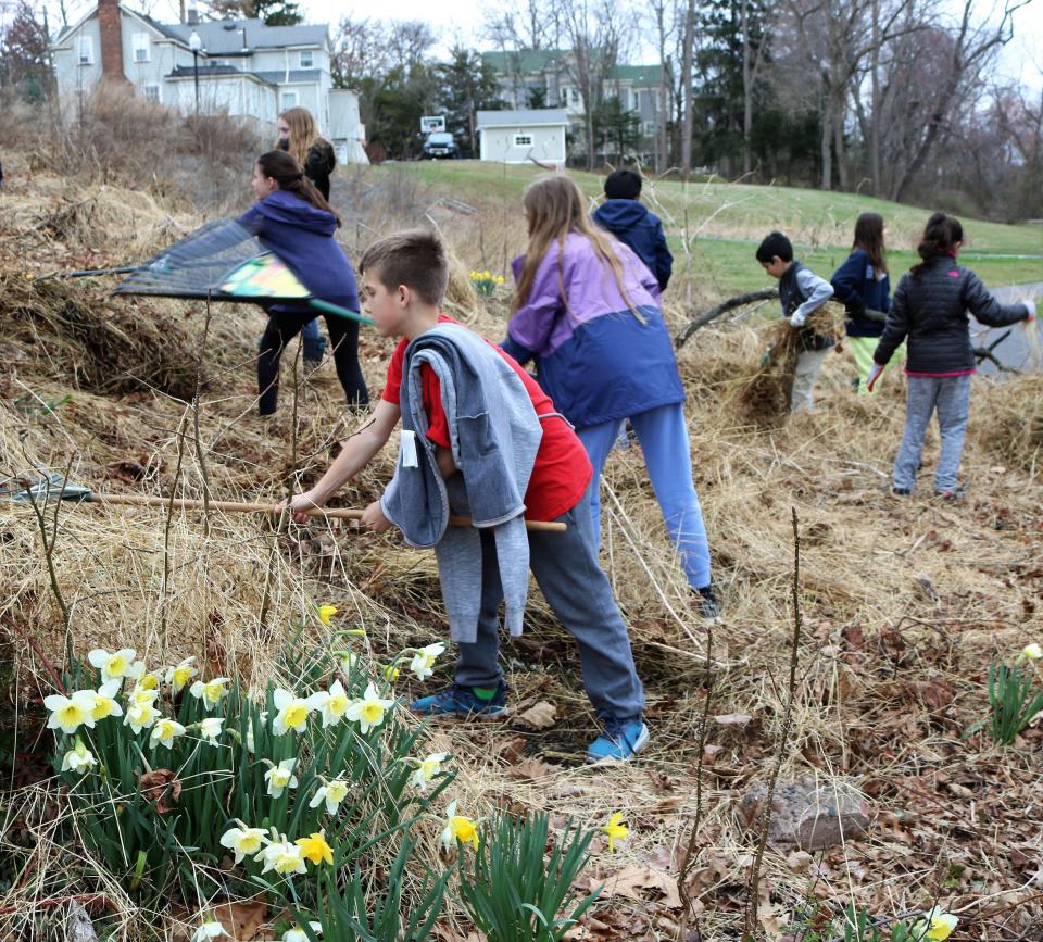 Fifth-graders at Washington Elementary School take part in a targeted clean up of Mindowaskin Park as part of a series of district wide community service projects in March.