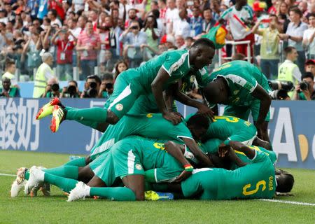 Soccer Football - World Cup - Group H - Poland vs Senegal - Spartak Stadium, Moscow, Russia - June 19, 2018 Senegal's M'Baye Niang celebrates scoring their second goal with team mates REUTERS/Grigory Dukor