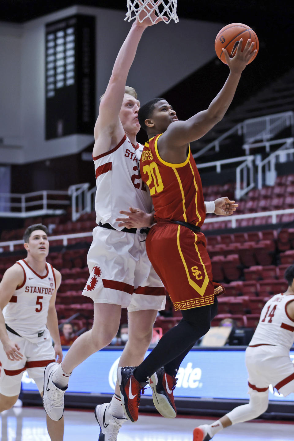 Stanford forward James Keefe (22) defends as Southern California guard Ethan Anderson (20) aims for the basket during the first half of an NCAA college basketball game Tuesday, Jan. 11, 2022, in Stanford, Calif. (AP Photo/Josie Lepe)