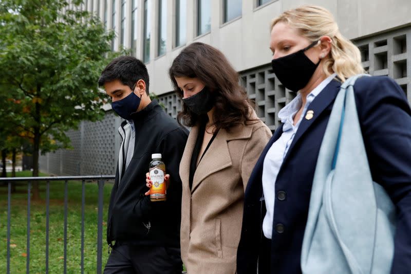 A woman who testified as Jane Doe-12 exits the sentencing hearing in the sex trafficking and racketeering case against NXIVM cult leader Keith Raniere outside the Brooklyn Federal Courthouse in New York