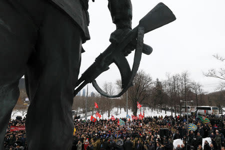 People attend a ceremony marking the 30th anniversary of the withdrawal of Soviet troops from Afghanistan at Victory Park, also known as Poklonnaya Gora War Memorial Park, in Moscow, Russia February 15, 2019. REUTERS/Shamil Zhumatov