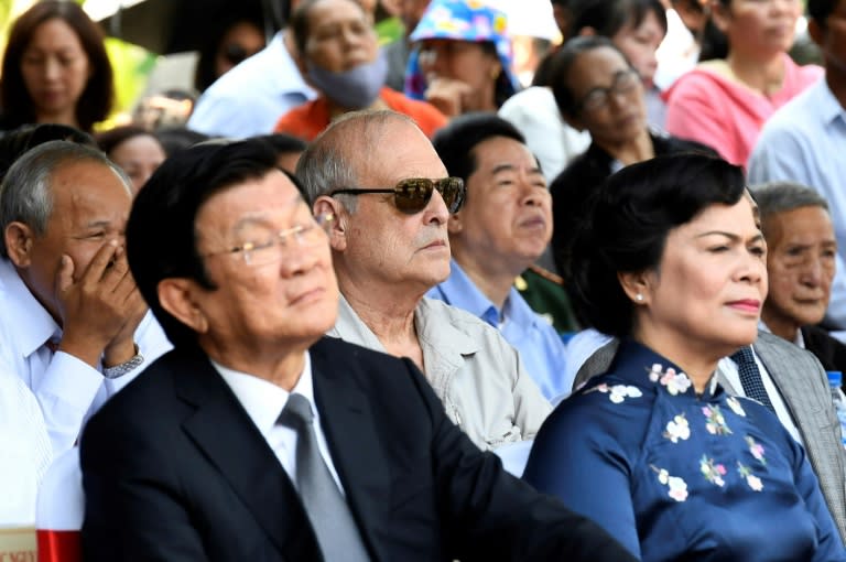 Ronald Haeberle (C- with sunglasses) said he came back to My Lai to repent for the horrors of the Vietnam War's deadliest massacre