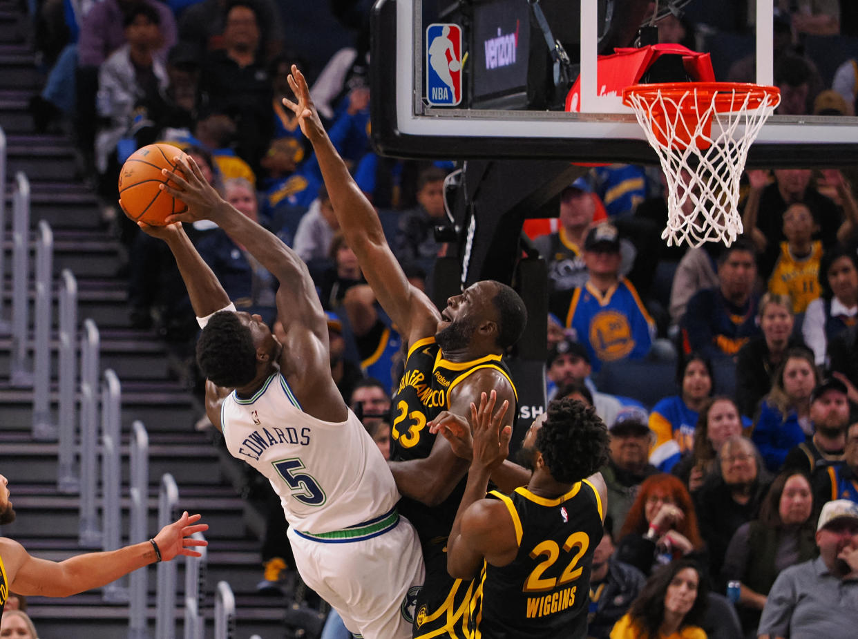 Minnesota Timberwolves guard Anthony Edwards shoots against Golden State Warriors forward Draymond Green in the fourth quarter at Chase Center in San Francisco on November 12, 2023.  (Kelly L. Cox/USA TODAY Sports)