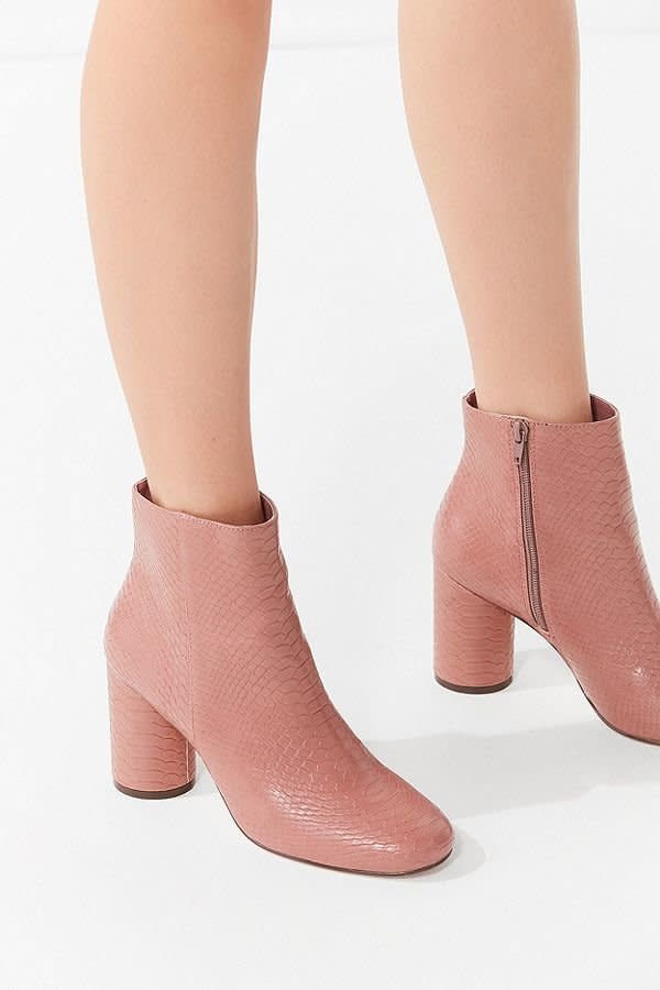 <a href="https://www.urbanoutfitters.com/shop/sabrina-faux-snakeskin-ankle-boot?category=women-shoes-on-sale&amp;color=054" target="_blank">These faux snakeskin booties</a> are the perfect spring color, and did we mention they're $39 from $79? We'll take two pairs, please.