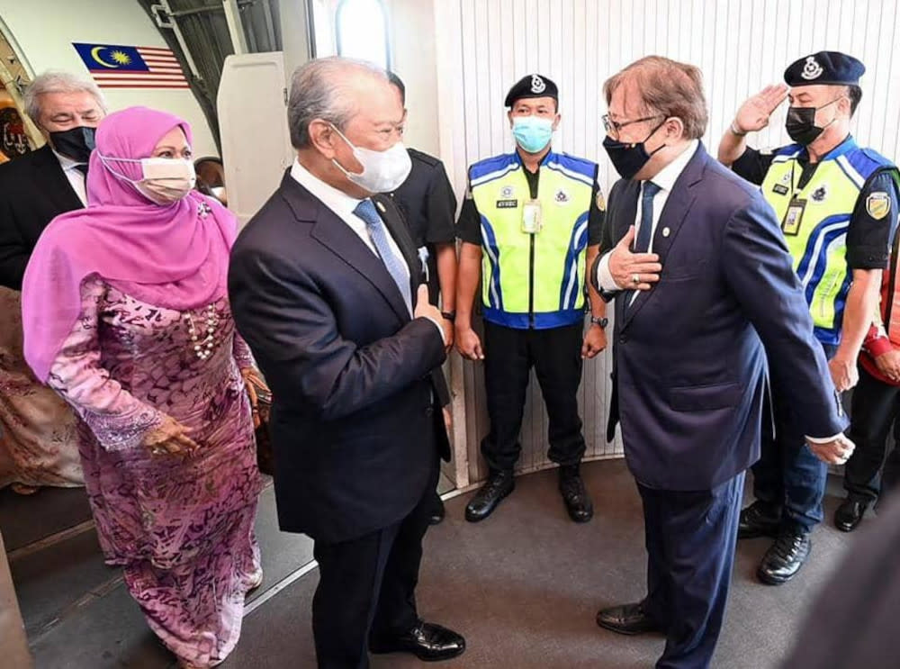 Tan Sri Muhyiddin Yassin and Sarawak Chief Minister Datuk Patinggi Abang Johari Tun Openg greet each other in Kuching. — Picture from Facebook/Muhyiddin Yassin