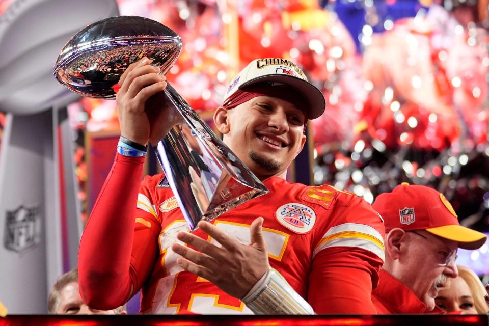 Chiefs quarterback Patrick Mahomes celebrates with the Vince Lombardi Trophy after the Chiefs' 25-22 overtime win in Super Bowl 58 on Sunday, Feb. 11, 2024, in Las Vegas.