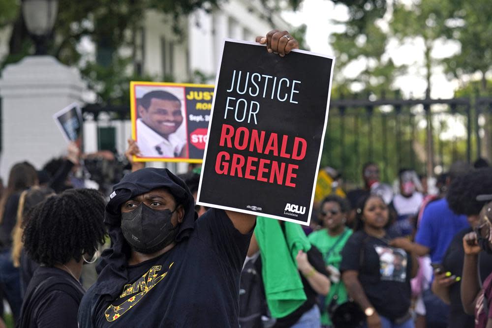 In this Thursday, May 27, 2021, file photo, demonstrators stand in front of the governor’s mansion after a march from the state Capitol in Baton Rouge, La., protesting the death of Ronald Greene, who died in the custody of Louisiana State Police in 2019. (AP Photo/Gerald Herbert, File)