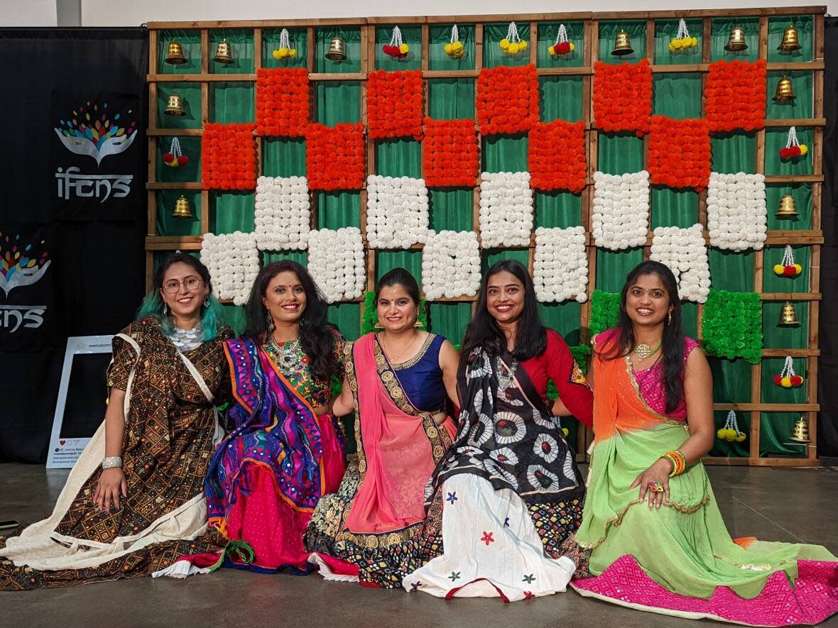 Members of the Garba Queens dance troupe, including Grishma Purohit, centre, are performing at India Fest. (Victoria Welland/CBC - image credit)