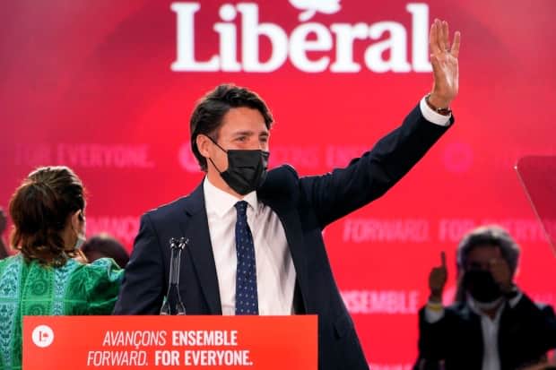 Prime Minister Justin Trudeau greets supporters prior to his victory speech at Liberal Party campaign headquarters in Montreal, early Tuesday morning.  (Paul Chiasson/The Canadian Press - image credit)