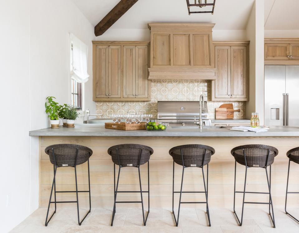 Take cues from Marie Flanigan and model your outdoor kitchen cabinets after your interior ones.