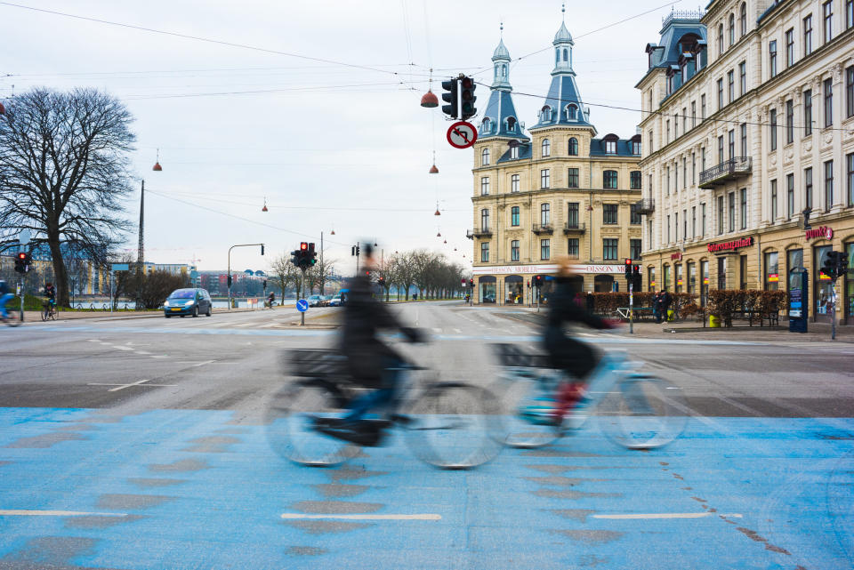 People bike riding in Copenhagen.