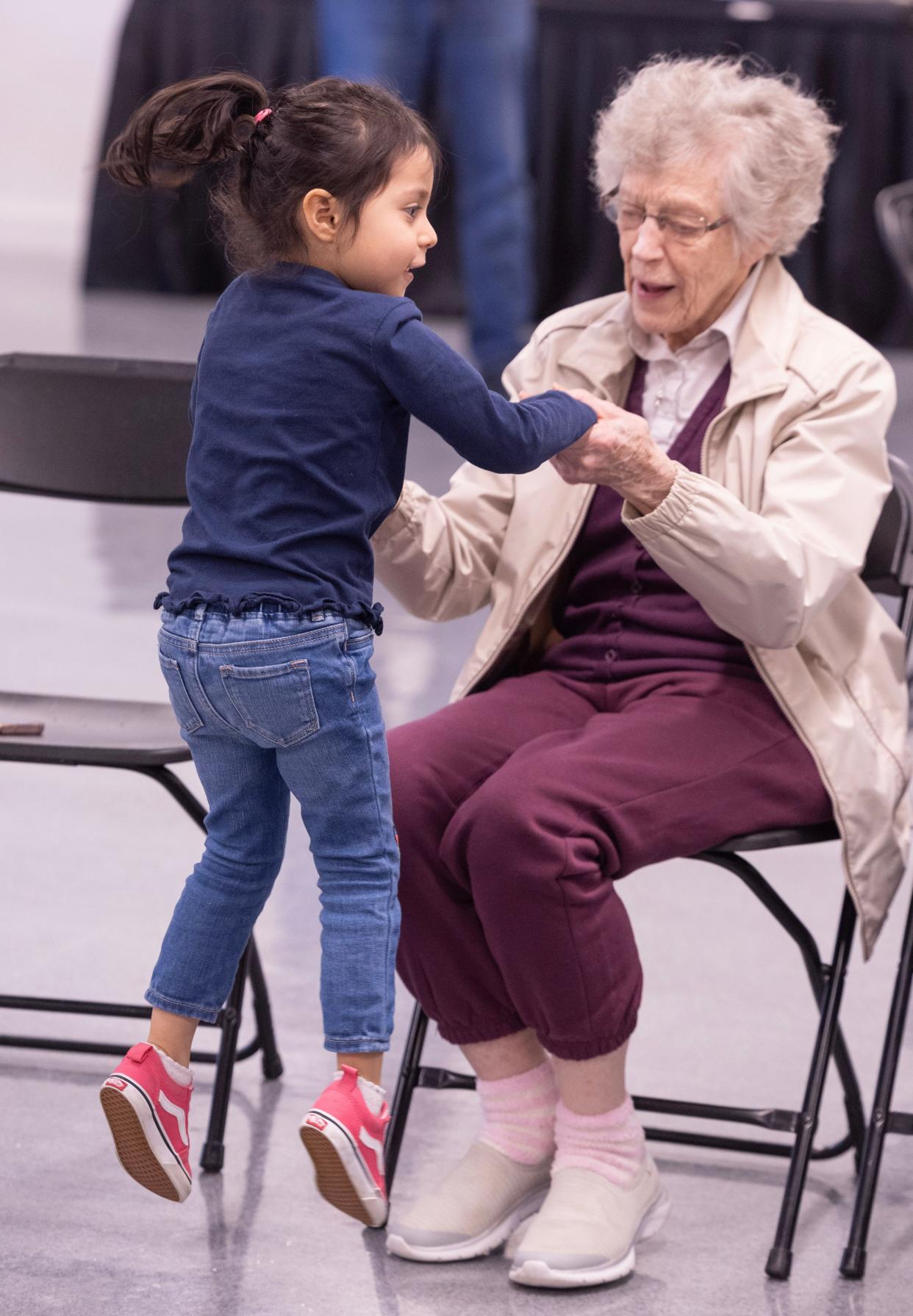 Stephanie Gutierrez, 5, dances with Rosemary Triplett during an intergenerational Artful Living and Learning class at the Massillon Museum.