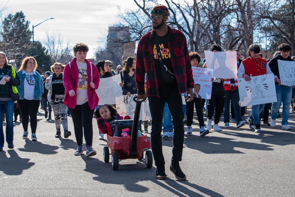 Marchers leave Washington Park and make their way to the Colorado State University Campus during the annual Martin Luther King Jr. Day march on Monday, Jan. 16, 2023, in Fort Collins, Colo.