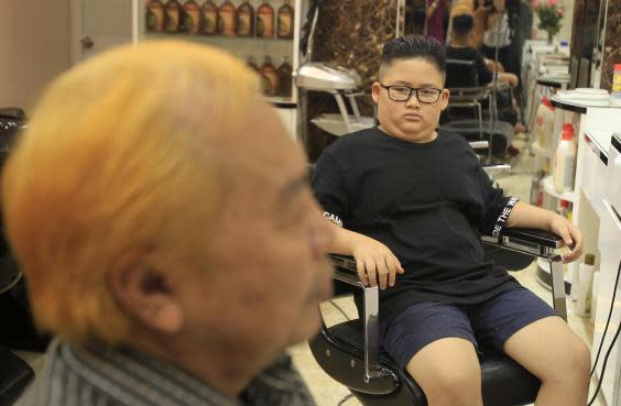 People in Hanoi are getting hairdos inspired by US and North Korean leaders (AP)