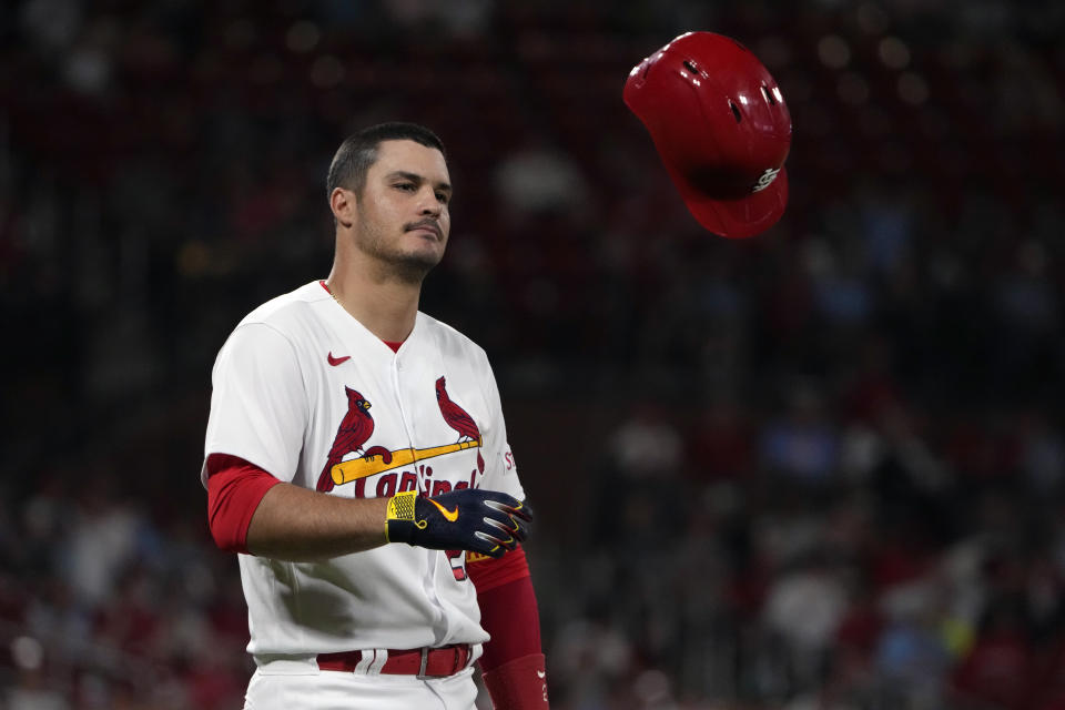 St. Louis Cardinals' Nolan Arenado tosses his helmet after flying out to end the eighth inning of a baseball game against the Minnesota Twins Tuesday, Aug. 1, 2023, in St. Louis. (AP Photo/Jeff Roberson)