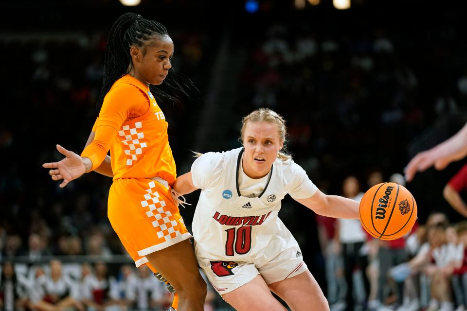 Louisville's Hailey Van Lith heads to the basket as Tennessee's Jordan Walker defends during the first half of a college basketball game in the Sweet 16 round of the NCAA women's tournament Saturday, March 26, 2022, in Wichita, Kan.