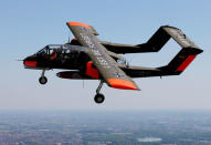 An OV-10 Bronco aircraft, decorated with World War One commemoration motifs, flies over Flanders international airport, ahead of the world's first Short Take Off & Landing competition on sand, in Wevelgem, Belgium May 8, 2018. REUTERS/Francois Lenoir